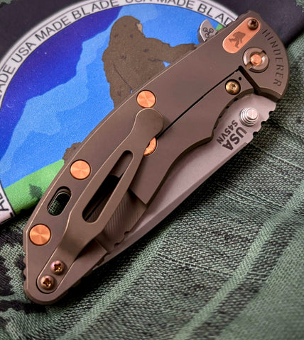 Hinderer XM-18 3.5 Slicer Battle Bronze Ti and Copper with Sasquatch Tab SW S45 Tanslucent Green G10