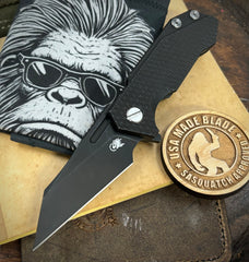 Topo Battle Black Wharnie Full Ti Hinderer Half Track Gen 2 Textured Ti Presentation side Magnacut Battle Black Blade and Sasquatched Clip