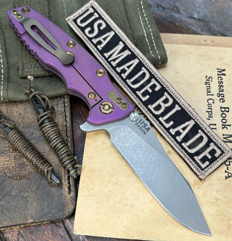 High Res Battle Purple Hinderer Eklipse 3.5" Hollow Grind Slicer Black G10 Anodized Ti  Working Finish S45VN Blade Bronzed Out HW