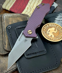 High Res Battle Purple Wharnie Hinderer Half Track Gen 2 Anodized Textured Ti Presentation Side, Smooth Ti Lockside Magnacut Working Finish Blade Bronzed Out HW
