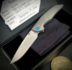 Koenig Xenon with M390 Burnished Blade with Polished Flats Smooth Ti Handles and Blue Ti Hardware XE1111111221
