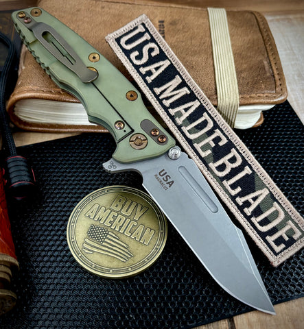 Battle Green Hinderer Eklipse 3.5" Skinny Fullered Harpoon Spanto FDE G10 Anodized Working Finish Ti with Working Finish  Magnacut Blade and bronzed out hardware