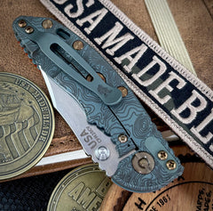 Topo Ammo Can Green Hinderer XM-18 3.0" Bowie Non-Flipper Orange G10 Anodized Working Finish Ti with Stonewashed 20CV Blade Bronzed Out Hardware and Sasquatch Clip - USA MB