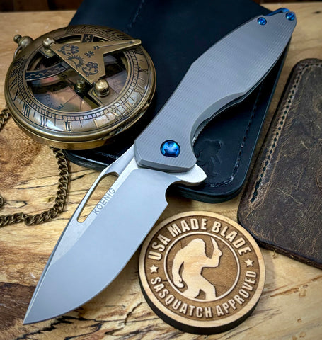 Koenig Mini Arius with M390 Burnished Blade with Polished Flats Plexa Ti and Blue Ti Hardware - USA MB