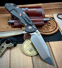 Hinderer XM-24 Harpoon Spanto Orange/Black G10 Battle Black Textured Ti and S45VN Stonewashed Blade with Copper Hardware