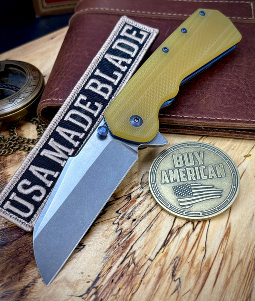 A2D Delta Liner Lock Stonewashed Satin Magnacut Sheepsfoot Blade with Amber G10 over blue ano liners  on bearings