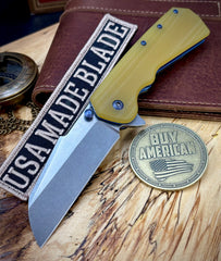A2D Delta Liner Lock Stonewashed Satin Magnacut Sheepsfoot Blade with Amber G10 over blue ano liners  on bearings
