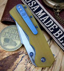 A2D Delta Liner Lock Stonewashed Satin Magnacut Sheepsfoot Blade with Amber G10 over blue ano liners  on bearings