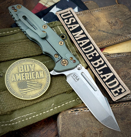 Ammo Can Green Hinderer Eklipse 3.5" Skinny Fullered Harpoon Spanto Blue/Black G10 Anodized Working Finish Ti Stonewashed Magnacut Blade with bronzed out hardware