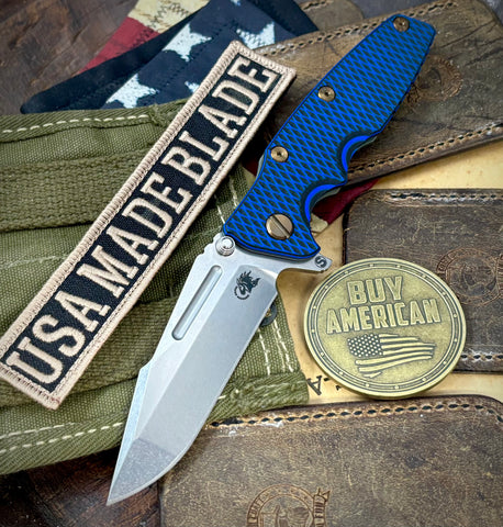 Ammo Can Green Hinderer Eklipse 3.5" Skinny Fullered Harpoon Spanto Blue/Black G10 Anodized Working Finish Ti Stonewashed Magnacut Blade with bronzed out hardware