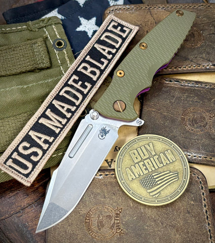 High Res Purple Hinderer Eklipse 3.5" Skinny Fullered Harpoon Spanto OD Green G10 Anodized Stonewash Ti Stonewashed Magnacut Blade with bronzed out hardware