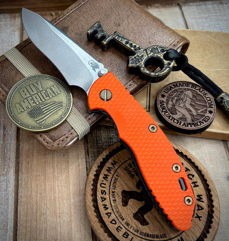 Topo Ammo Can Green Hinderer XM-18 3.5" Recurve Non-flipper Orange G10 Working Finish Ti Stonewashed Finish Magnacut Blade Bronzed Out HW and Squatched Clip