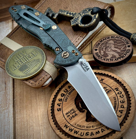 Topo Ammo Can Green Hinderer XM-18 3.5" Recurve Non-flipper OD Green G10 Working Finish Ti Stonewashed Finish Magnacut Blade Bronzed Out HW and Squatched Clip