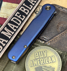 High Res Slate Blue Rockwall Flipper with Magnacut Blade Countoured Ti Handles with bronze ti hardware from Tactile Knife Co. - USA MB