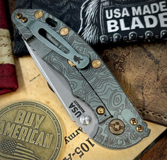 Topo Ammo Can Green Hinderer XM-18 3.5" Recurve Non-flipper OD Green G10 Working Finish Ti Working Finish Magnacut Blade Bronzed Out HW and Squatched Clip