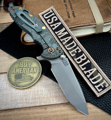 Topo Ammo Can Green Hinderer XM-18 3.25 Spanto Blue/Black G10 Anodized Working Finish Topo Ti Working Finish Magnacut Blade and Sasquatch Clip - USA MB