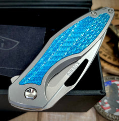 Koenig Mini Arius with M390 Aqua Blue Twill Inlay Brightwash Blade with Polished Flats and Silver Ti Hardware