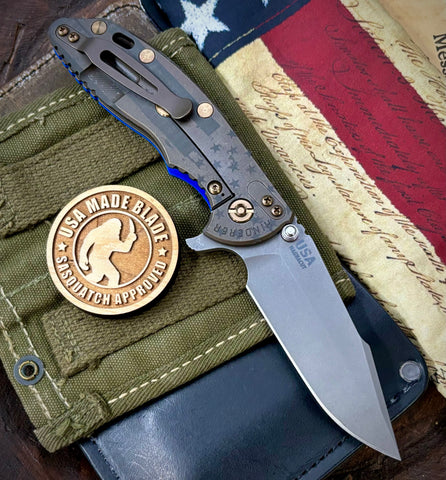 Battled Stars & Stripes Hinderer XM-18 3.5" Skinny Harpoon Spanto Battle Bronze Ti Blue G10 Magnacut Working Finish Blade Bronzed Out HW