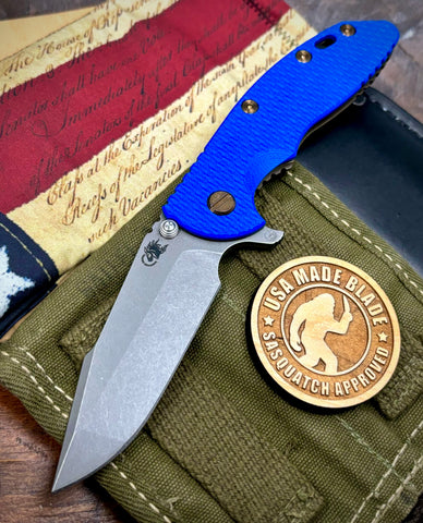 Battled Stars & Stripes Hinderer XM-18 3.5" Skinny Harpoon Spanto Battle Bronze Ti Blue G10 Magnacut Working Finish Blade Bronzed Out HW