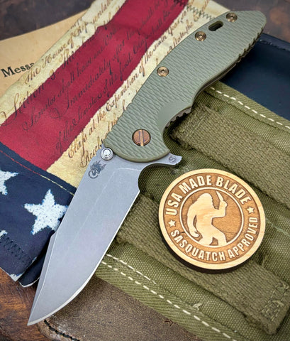 Battled Stars & Stripes Hinderer XM-18 3.5" Skinny Harpoon Spanto Battle Bronze Ti OD Green G10 Magnacut Working Finish Blade Bronzed Out HW