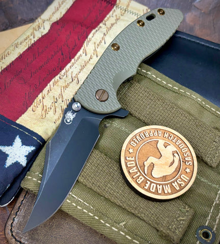 Battled Stars & Stripes Hinderer XM-18 3.5 Bowie Battle Black Ti OD Green G10 Battle Black Magnacut Blade Bronzed Out HW