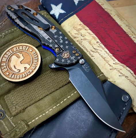 Battled Stars & Stripes Hinderer XM-18 3.5 Bowie Battle Black Ti Blue G10 Battle Black Magnacut Blade Bronzed Out HW