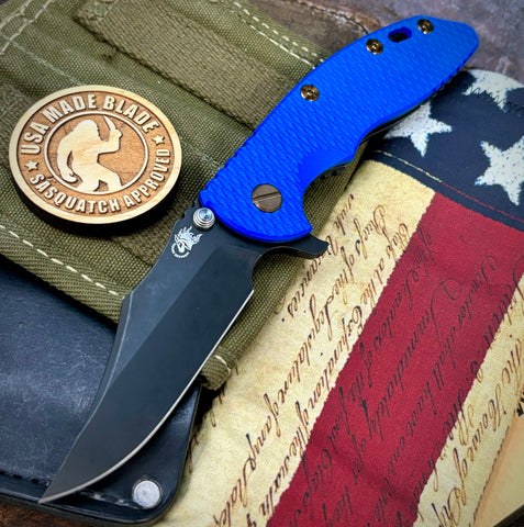 Battled Stars & Stripes Hinderer XM-18 3.5 Bowie Battle Black Ti Blue G10 Battle Black Magnacut Blade Bronzed Out HW