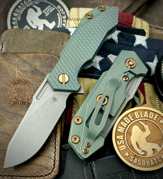 Ammo Can Green Slicer Hinderer Half Track Gen 2 Anodized Textured Ti Presentation Side, Smooth Ti Lockside Magnacut Working Finish Blade Bronzed Out HW