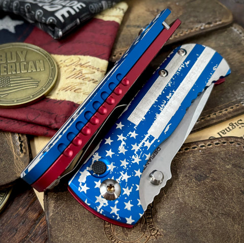 Defiant-7 Talos Button Lock Battled Stars & Stripes with Magnacut Blade and Blue/Red Hardcoat Anodized Aluminum Handles