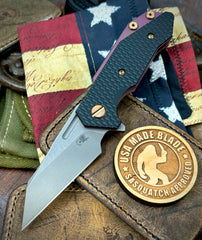 High Res Battle Purple Wharnie Hinderer Half Track Gen 2 Black G10 Anodized Working Finish Ti with Working Finish Magnacut Blade and Bronzed Out HW