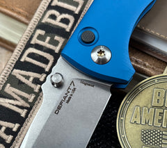 Defiant-7 Talos Button Lock with Magnacut Blade and Blue Hardcoat Anodized Aluminum Handles