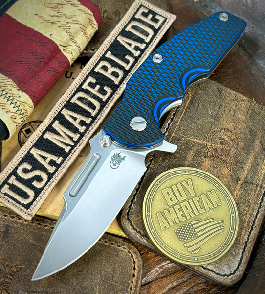 Hinderer Jurassic Clip Point Blue/Black G10 Working Finish Ti Magnacut Stonewashed Blade
