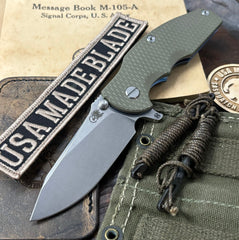 Hinderer Jurassic Hollow Ground Slicer OD Green G10 Blue Ti Magnacut Stonewashed Blade