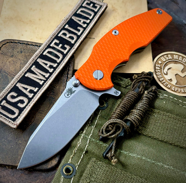 Hinderer Jurassic Hollow Ground Slicer Orange G10 Bronze Ti Magnacut Stonewashed Blade