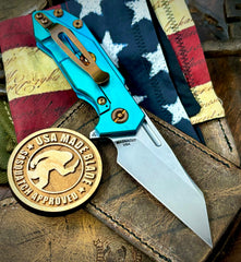 Caribbean Blue Wharnie Hinderer Half Track Gen 2 Textured Ti Anodized Stonewashed Presentation Side, Smooth Ti Lockside Magnacut Stonewashed Blade Bronzed Out HW