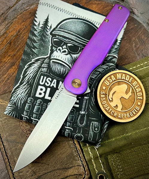 High Res Deep Purple Anodized Rockwall Flipper with Stonewashed Magnacut Blade Countoured Ti Handles with Bronze Ti Hardware from Tactile Knife Co.
