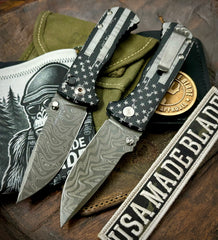 Battle Stars & Stripes Defiant-7 Talos Button Lock with Black Boomerang Stainless Chad Nichols Damascus Blade and Black Hardcoat Anodized Aluminum Handles
