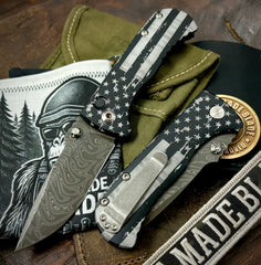 Battle Stars & Stripes Defiant-7 Talos Button Lock with Black Boomerang Stainless Chad Nichols Damascus Blade and Black Hardcoat Anodized Aluminum Handles