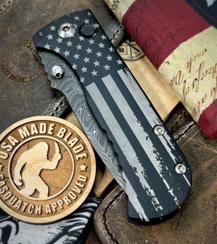 Battle Stars & Stripes Distressed Flag Defiant-7 Talos Button Lock with Black Boomerang Stainless Chad Nichols Damascus Blade and Black Hardcoat Anodized Aluminum Handles - USA MB