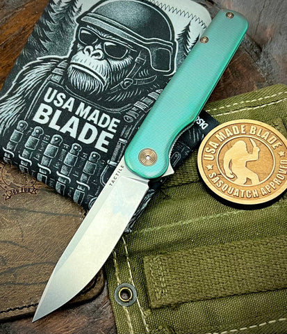 Green and Bronze Anodized Rockwall Flipper with Stonewashed Magnacut Blade Countoured Ti Handles with Ti Hardware from Tactile Knife Co.