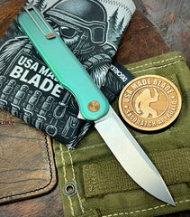 Green and Bronze Anodized Rockwall Flipper with Stonewashed Magnacut Blade Countoured Ti Handles with Ti Hardware from Tactile Knife Co.