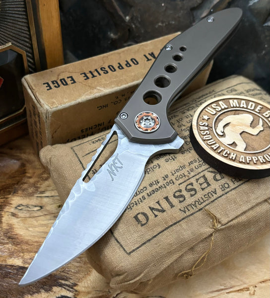 NK&T Custom Hydra Framelock with 5/32 Magnacut Blade Jaeco Finish, Bronze Ti  Speedhole Handles, Bronze Ti Hardware and Copper Pivot Collar