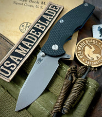 Hinderer Jurassic Hollow Ground Slicer Black G10 Battle Blue Ti Magnacut Working Finish Blade