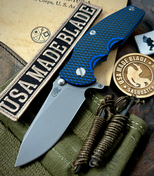 Hinderer Jurassic Hollow Ground Slicer Blue/Black G10 Battle Blue Ti Magnacut Working Finish Blade