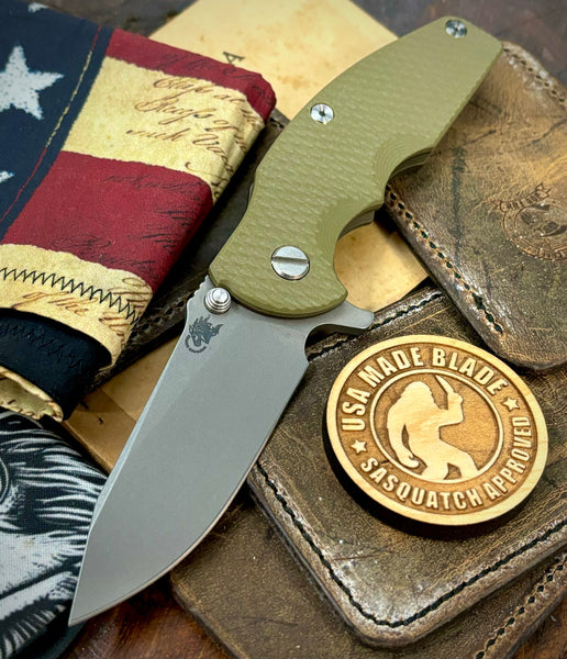 Hinderer Jurassic Slicer OD Green G10 Battle Bronze Ti Magnacut Working Finish Blade