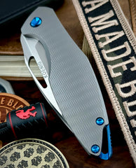 Non Flipper Koenig Mini Arius with M390 Burnished Blade with Polished Flats Plexa Ti and Blue Ti Hardware  MA21511221P - USA MB