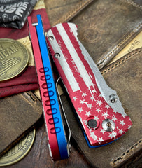 Defiant-7 Talos Button Lock Battled Stars & Stripes with Magnacut Blade and Red/Blue Hardcoat Anodized Aluminum Handles