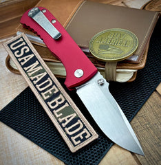 Defiant-7 Talos Button Lock with Magnacut Blade and Red Hardcoat Anodized Aluminum Handles