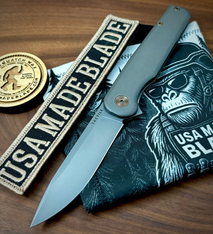 Rockwall Flipper with Slate Gray Magnacut Blade Countoured Ti Handles with bronze ti hardware from Tactile Knife Co.