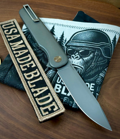 Rockwall Flipper with Slate Gray Magnacut Blade Countoured Ti Handles with bronze ti hardware from Tactile Knife Co.